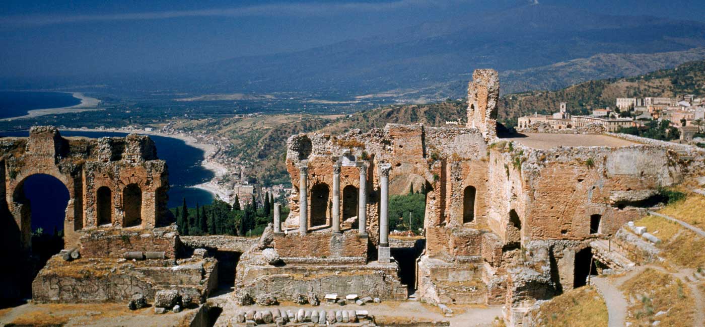 Ruins of a building on a hillside in Taormina, Sicily, Italy.